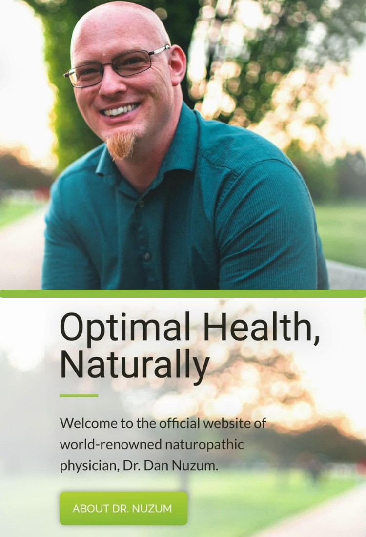 Dr. Nuzum Optimal health, naturally. Learn more about Dr. Nuzum and his story. Dr. Nuzum on bench outside with trees at sunset. Background blurred.